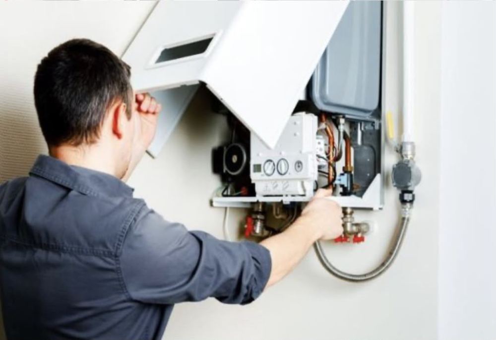 Technician inspecting a gas boiler